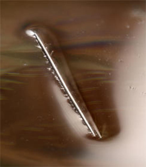 steel-needle-floats-on-surface-film-of-water-244.jpg 