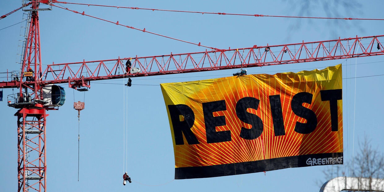 Greenpeace crane protesters near White House call for resistance to
