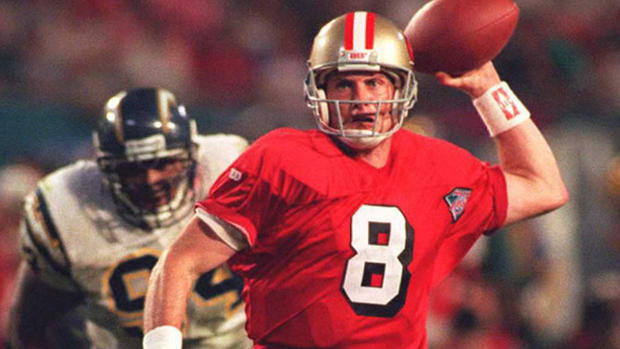 San Francisco 49ers quarterback Steve Young (R) sc 