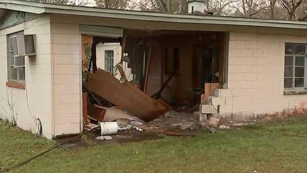 A stolen SUV was driven through a home in Jacksonville, Florida, killing a woman inside watching TV on Feb. 7, 2017. 