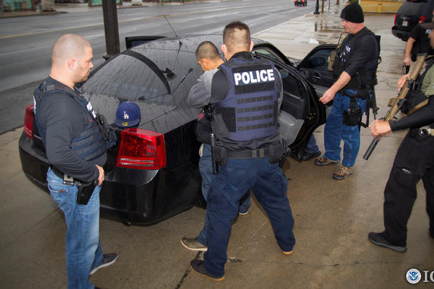 U.S. Immigration and Customs Enforcement (ICE) officers detain a suspect as they conduct a targeted enforcement operation in Los Angeles, California, on Feb. 7, 2017. 