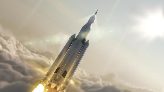An artist’s impression of a Space Launch System rocket boosting an Orion crew capsule toward space. 