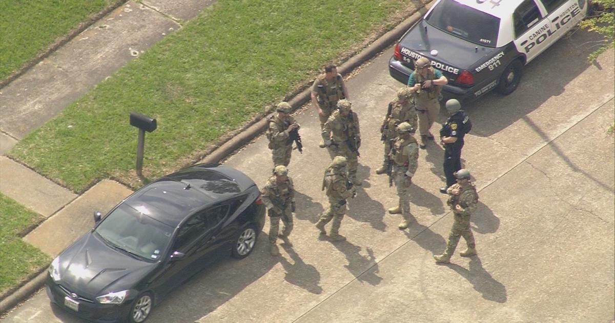 Police In Houston Search For Suspect After Officers Shot - CBS News