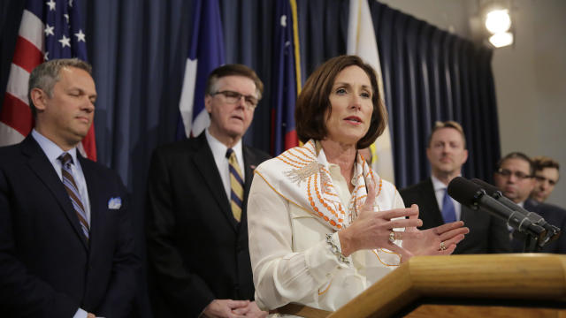 Texas Sen. Lois Kolkhorst, front, backed by Texas Lt. Gov. Dan Patrick, center, and other legislators, talks to the media during a news conference to discuss Senate Bill 6, the so-called “bathroom bill,” at the Texas Capitol March 6, 2017, in Austin, Texa 