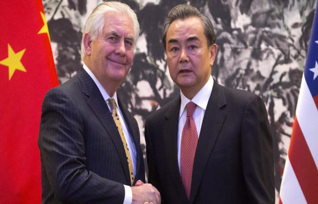 U.S. Secretary of State Rex Tillerson and Chinese Foreign Minister Wang Yi shake hands at the end of a joint press conference at the Diaoyutai State Guesthouse in Beijing, China, March 18, 2017. 