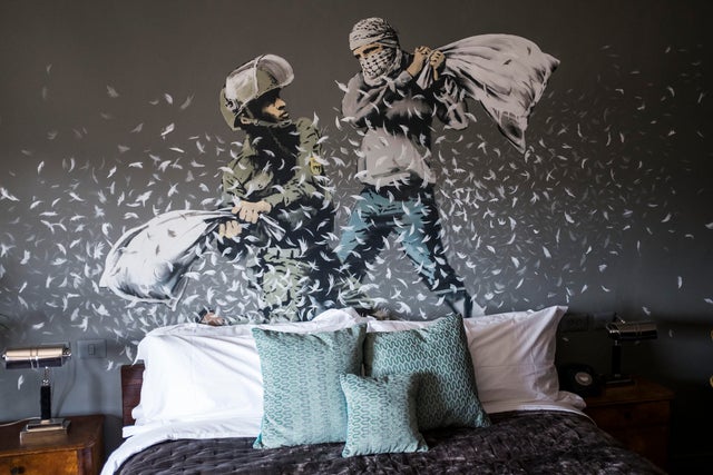 Banksy opens Walled Off Hotel in West Bank town of Bethlehem