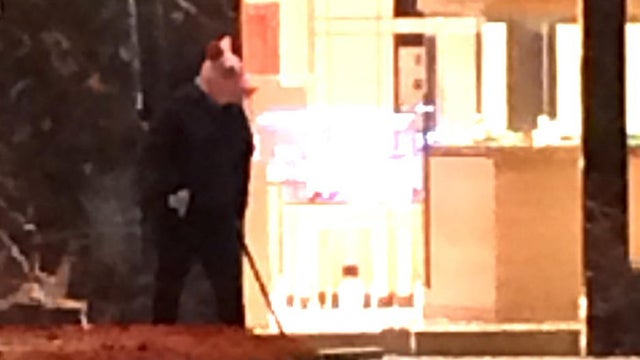 A person wearing a pig mask was taken into custody as police investigated reports of an armed robbery at the Bellagio Hotel and Casino in Las Vegas on March 25, 2017. 