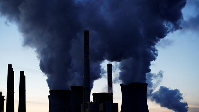 Emissions spew out of a large stack at the coal-fired Morgantown Generating Station on Oct. 10, 2017, in Newburg, Maryland. 