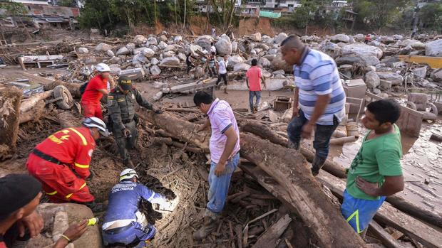 Torrent of floodwaters sweeps through Colombian town 