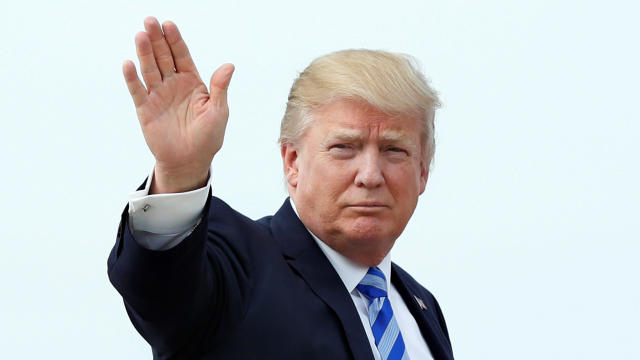President Trump waves as he boards Air Force One at Joint Base Andrews outside Washington before traveling to Palm Beach, Florida, for the Good Friday holiday and Easter weekend April 13, 2017. 