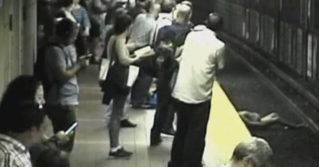 Witnesses rescue woman from train tracks in Boston - CBS News