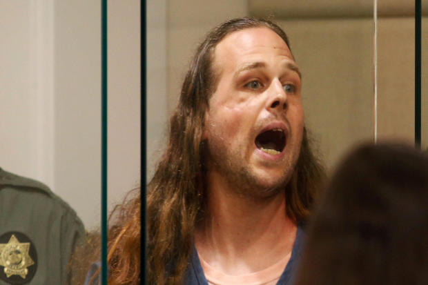A convicted felon, Jeremy Christian, 35, accused of fatally stabbing two Good Samaritans who tried to stop Christian from harassing a pair of women who appeared to be Muslim, shouts during an appearance in Multnomah County Circuit Court in Portland, Orego 