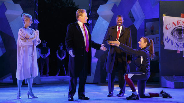 Tina Benko, left, portrays Melania Trump in the role of Caesar's wife, Calpurnia, and Gregg Henry, center left, portrays President Trump in the role of Julius Caesar during a dress rehearsal of The Public Theater's Free Shakespeare in the Park production 