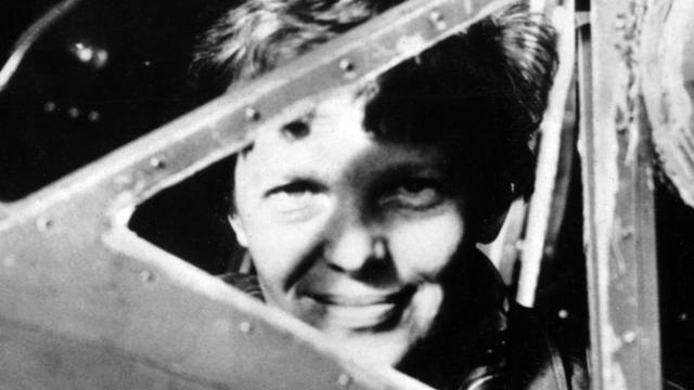 American female aviator Amelia Earhart looks trough the cockpit window of her plane in an undated photo taken in the 1930s. 