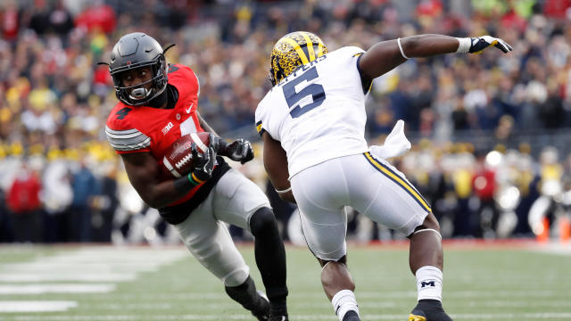 Curtis Samuel, No. 4 of the Ohio State Buckeyes, rushes the ball in overtime against the Michigan Wolverines at Ohio Stadium on Nov. 26, 2016, in Columbus, Ohio. 