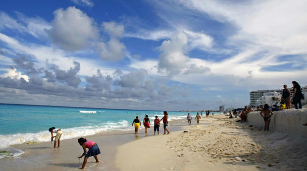 People enjoy the beach in Cancun, state 