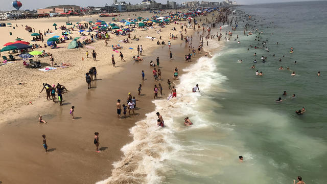 Sunbathers crowd the beach in Ocean City, Maryland, July 22, 2017. 