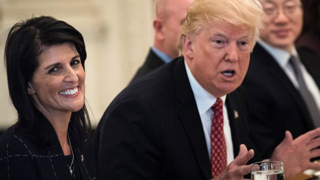 U.S. Ambassador to the U.N. Nikki Haley smiles while President Trump speaks before a working lunch with U.N. Security Council member nations in the State Dining Room of the White House April 24, 2017, in Washington. 