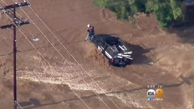 Several drivers were trapped and rescued after heavy rain flooded a Southern California neighborhood on Aug. 3, 2017. 