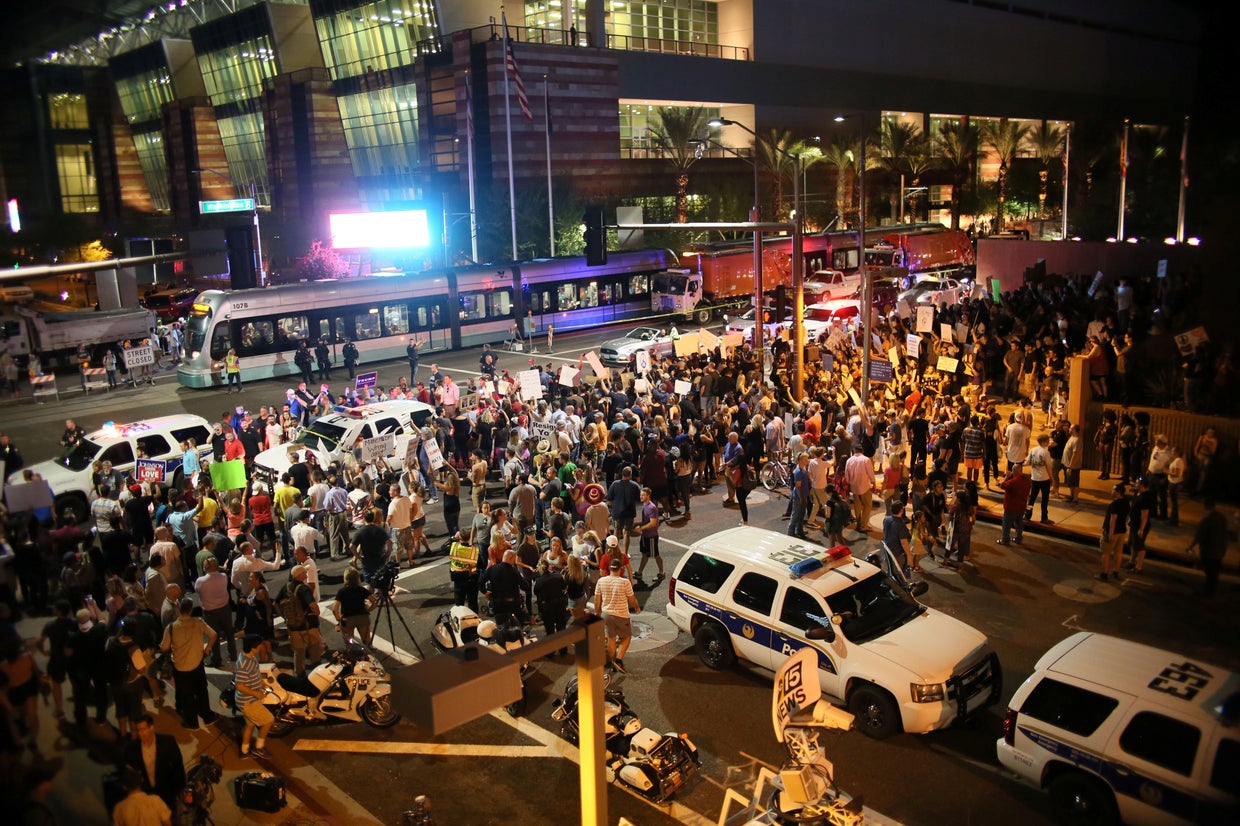 Police fire gas, flash bangs on unruly crowd outside Trump rally in ...