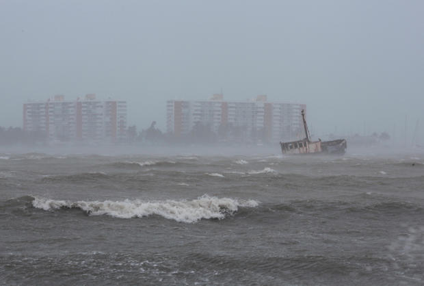 Waves battle a stranded ship in Fajardo as Hurricane Irma slammed across islands in the northern Caribbean 