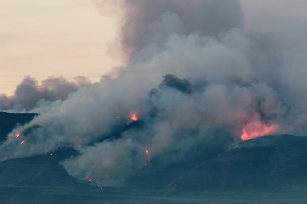 The Canyon Fire burns hillsides in Corona, California 