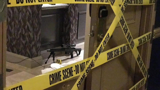 Crime scene tape lines the doors of gunman Stephen Paddock's suite on the 32nd floor of the Mandalay Bay Resort and Casino on the Las Vegas Strip in Las Vegas, Nevada, in this photo obtained by CBS News on Oct. 3, 2017. 