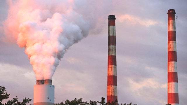 Emissions spew out of a large stack at the coal-fired Morgantown Generating Station on Oct. 10, 2017, in Newburg, Maryland. 