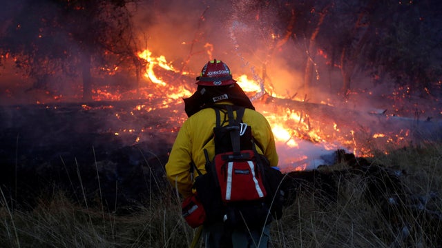Firefighters battle a wildfire near Santa Rosa, California 