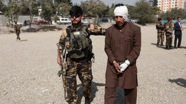 A captured Taliban insurgent is presented to the media after he was arrested with car explosive devices in Kabul, Afghanistan 