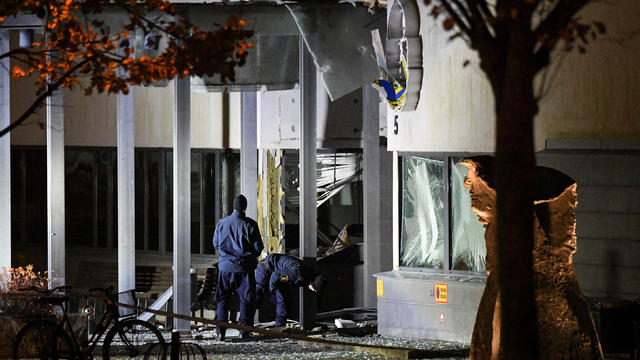 Police forensics work at the scene after a powerful explosion at the main entrance to the police station in Helsingborg 