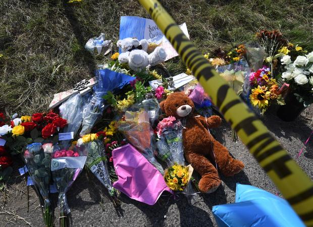 Texas church shooting memorial flowers and crime scene tape 