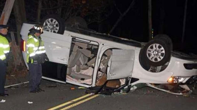 Crews work the scene after a deadly car accident involving a deer in Weston, Massachusetts, on Nov. 8, 2017. 