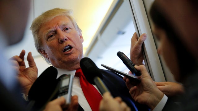 Trump talks to reporters en route to Hanoi, Vietnam 