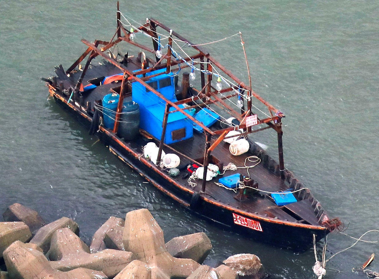 A wooden boat is seen near a breakwater in Yurihonjo 