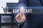 business, technology and internet concept - businessman pressing add to cart button on virtual screens 