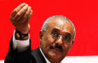 Yemen's then-President Ali Abdullah Saleh gestures during a gathering of supporters in Sanaa Feb. 20, 2011. 