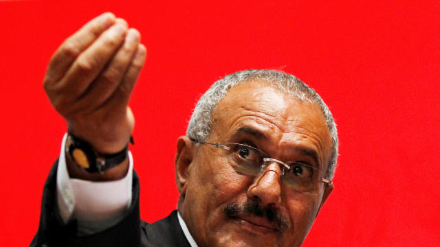 Yemen's then-President Ali Abdullah Saleh gestures during a gathering of supporters in Sanaa Feb. 20, 2011. 