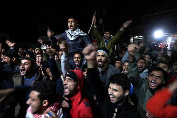 Palestinians react during a protest against Trump's decision to recognise Jerusalem as Israel's capital, in Khan Younis in the southern Gaza Strip 