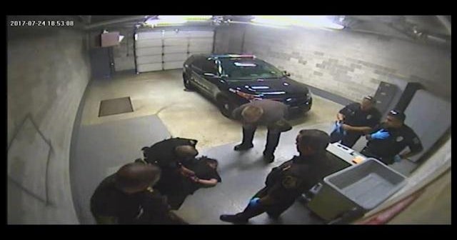 Jail video shows officer slamming handcuffed woman CBS News