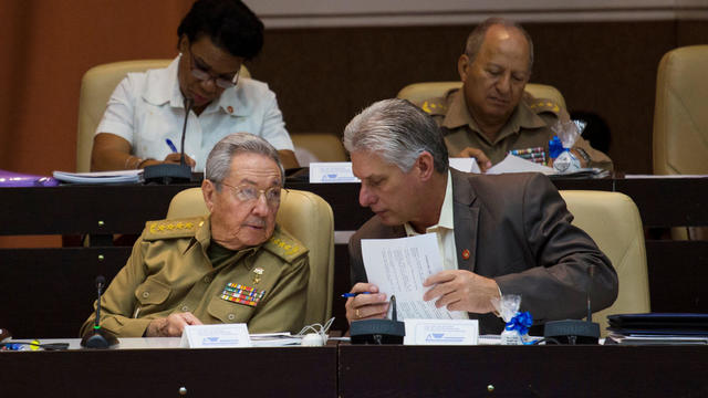 Cuba's President Raul Castro chats with Cuba's First Vice-President Miguel Diaz-Canel, during the National Assembly in Havana 
