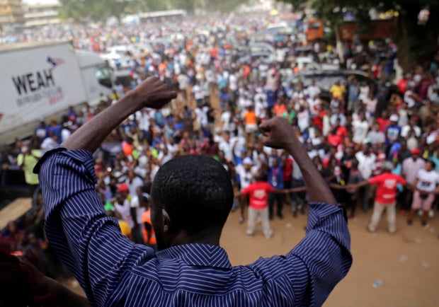 Supporters of President-elect George Weah of Coalition for Democratic Change (CDC) celebrate after the announcement of the presidential election results in Monrovia 