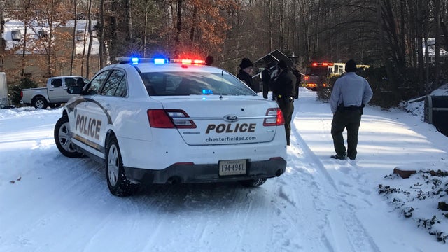Crews work the scene after police say a pickup truck hit a girl on a sled in Chester, Virginia, on Jan. 4, 2018. 