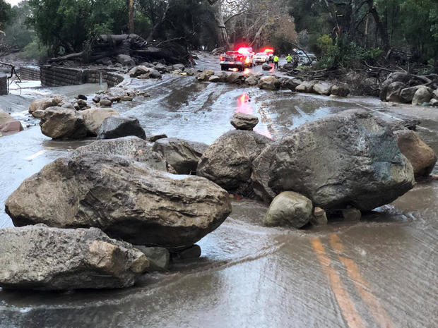 Boulders block a road after a mudslide in Montecito 