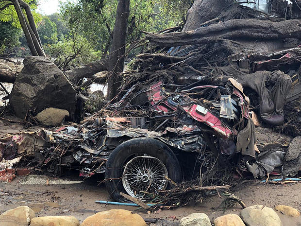 Parts of a car are entangled in debris after mudslides in Montecito 
