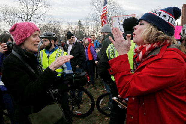 Carol Tierney and Mary Beth Geary discuss their opposing points of view at the second annual Women's March in Cambridge 