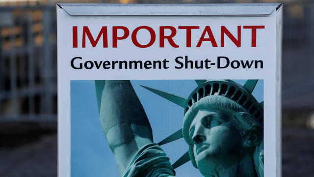 A sign announcing the closure of the Statue of Liberty, due to the U.S. government shutdown, sits near the ferry dock to the Statue of Liberty at Battery Park in Manhattan, New York 