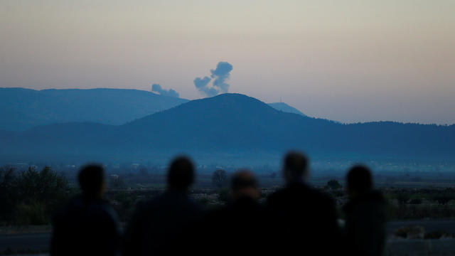 Smoke rises from the Syria's Afrin region, as it is pictured from near the Turkish town of Hassa, on the Turkish-Syrian border in Hatay province 