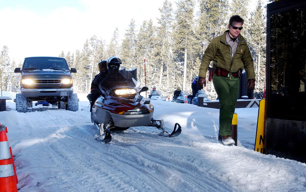 Snowmobilers Ride At Yellowstone National Despite Environmentalists Opposition 
