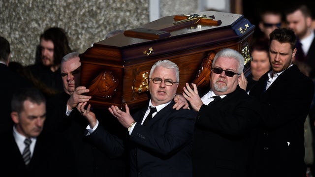 Dolores O'Riordan's coffin is carried out of her funeral at St Ailbe's Church in Ballybricken 